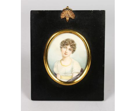 A GOOD OVAL PORTRAIT MINIATURE OF A YOUNG LADY in a white dress.