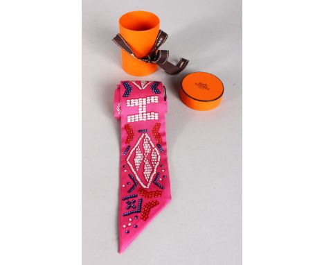 A SMALL HERMES SILK NECK TIE, boxed.