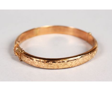 A 9CT GOLD BANGLE, 8gms.