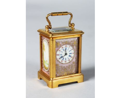 A MINIATURE SEVRES BRASS CARRIAGE CLOCK with pink painted porcelain panels.  2.5ins high.