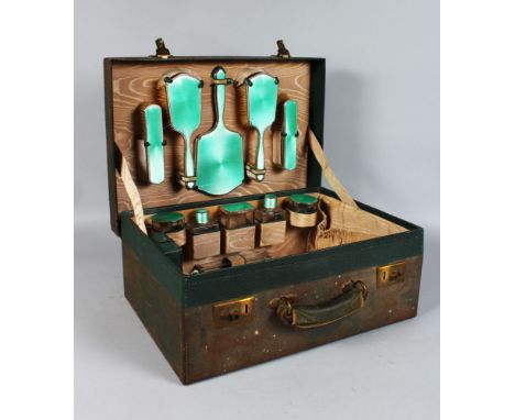 A GOOD LEATHER TRAVELLING CASE with glass, silver and enamel boxes. Birmingham 1935.  Maker: Walker & Hall.