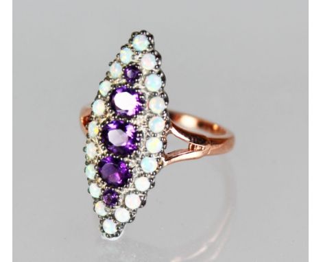 A NICE 15CT ROSE GOLD, AMETHYST AND OPAL MARQUISE RING.