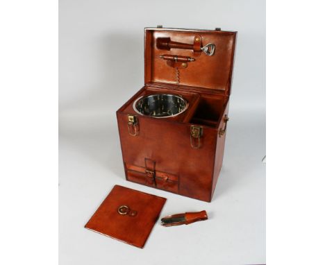 A GOOD LARGE LEATHER CHAMPAGNE HAMPER with champagne bucket, brass carrying handles. 13ins long, 15ins high.