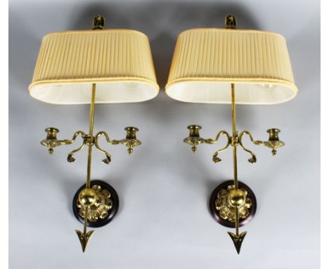 A PAIR OF GILDED METAL ARROW TWO BRANCH WALL SCONCES with silk shades.