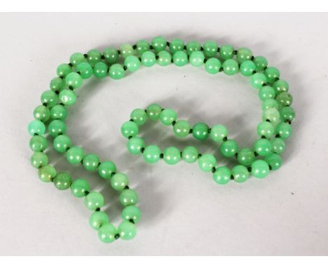 A GREEN JADE NECKLACE.