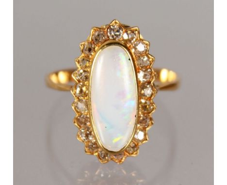 AN IMPRESSIVE YELLOW GOLD, OPAL AND DIAMOND CLUSTER RING.