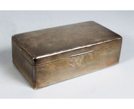 A LARGE ENGINE TURNED CIGARETTE BOX with cedar wood liner. 7.5ins high.  Sheffield 1935.  Maker: Walker & Hall.