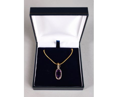 AN 18CT YELLOW GOLD SUBSTANTIAL AMETHYST AND DIAMOND PENDANT NECKLACE.