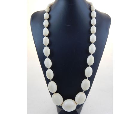 A Victorian single strand  graduated ivory bead necklace, L. 104 cm.