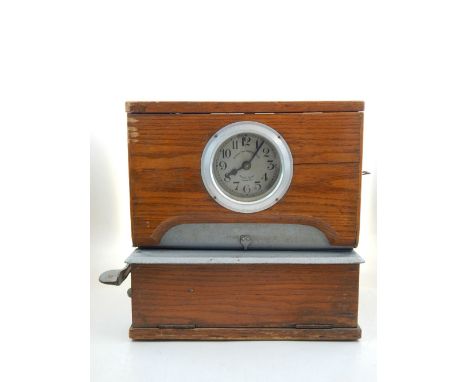 A National Time Recorder Ltd electric clocking in clock, model 521, oak cased circa 1960 (formerly housed in the Rootes Motor