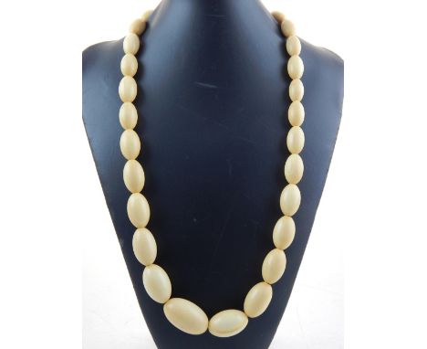 A Victorian single strand  graduated ivory bead necklace, L. 76 cm.