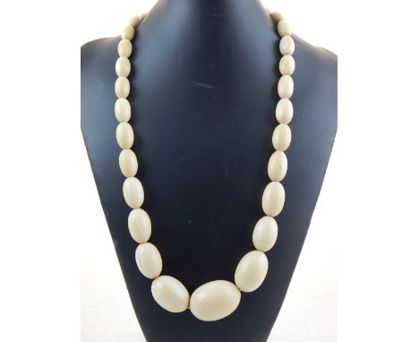 A Victorian single strand  graduated ivory bead necklace L 72 cms.