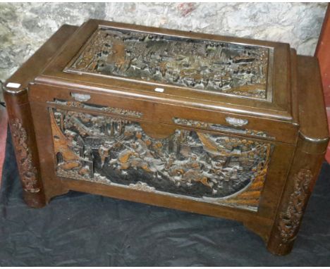Oriental carved camphor chest with fitted sliding shelf to interior, 57x104x54cm 