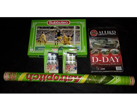 Subbuteo football set with 2 boxed teams, tub of astro pitch & D-day model 