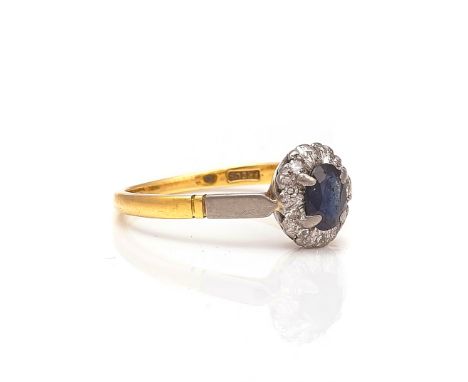 AN 18CT GOLD, SAPPHIRE AND DIAMOND OVAL CLUSTER RINGClaw set with the oval cut sapphire in a surround of circular cut diamond