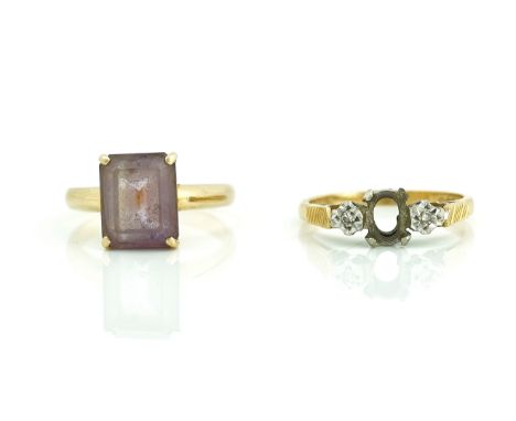 TWO GOLD AND GEM SET RINGS (2)Comprising; a gold ring, claw set with a rectangular step cut amethyst, detailed 750, ring size