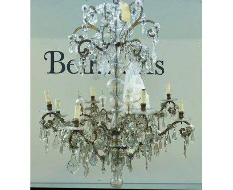 A LARGE ITALIAN CUT-GLASS AND GILT-IRON EIGHT-LIGHT CHANDELIERThe frame 19th centuryThe tiered frame with scroll branches hun