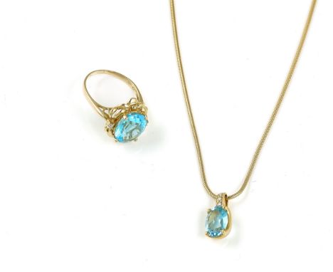 A GOLD, DIAMOND AND PALE BLUE TOPAZ PENDANT, A GOLD NECKCHAIN AND A RING (3)The pendant claw set with an oval cut blue topaz 