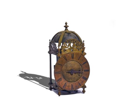 A BRASS LANTERN CLOCKIn the 17th Century styleOf typical form, surmounted by a bell and five finials, above pierced frets, wi