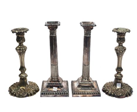 TWO PAIRS OF PLATED TABLE CANDLESTICKS (2)Comprising; a pair of dining table candlesticks, each formed as a Corinthian column