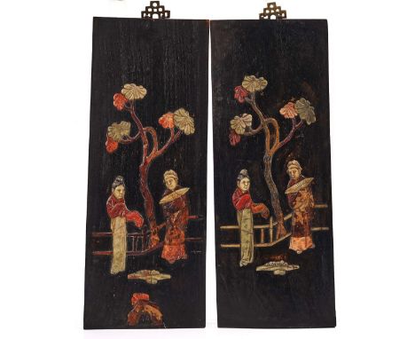 A PAIR OF CHINESE SOAPSTONE INLAID WOODEN PANELSLate 19th centuryEach inlaid with a man and woman standing before a tree, 45.
