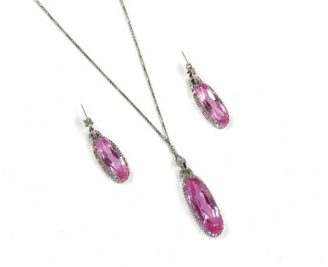 A SYNTHETIC PINK CORUNDUM AND DIAMOND SET PENDANT, NECKCHAIN AND PAIR OF EARRINGSThe pendant and the earrings each claw set w