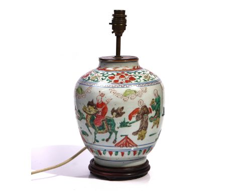 A CHINESE WUCAI OVOID VASE ADAPTED AS A LAMPIn 17th century style but probably laterPainted with a figure riding a qilin with