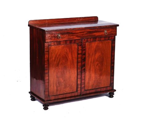 A GEORGE III MAHOGANY SIDE CABINETWith single drawer over a pair of panel cupboards, 99cm wide; 45cm deep; 98cm highGood deco