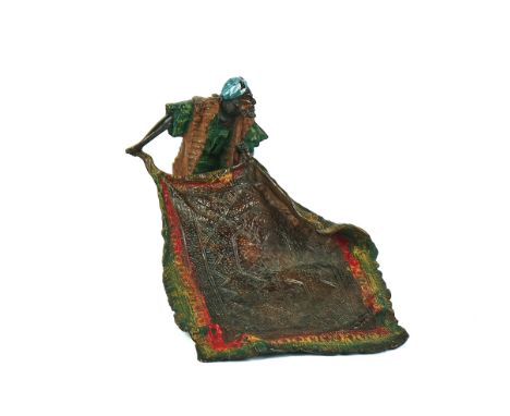 A POLYCHROME COLD PAINTED BRONZE MODEL OF A CARPET SELLERIn the manner of Franz Bergman21cm wide x 15.5cm highCondition repor