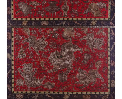 A CHINESE EMBROIDERED PANELLate 19th/20th centuryWorked in gold and silver thread with Buddhist lions and cubs against a red 