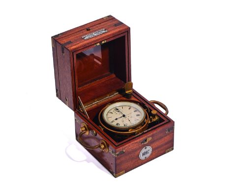 A SMALL SWISS MAHOGANY MARINE CHRONOMETERBy Ulysse Nardin, Le Locle, No 6097The three piece case with brass furniture, silver