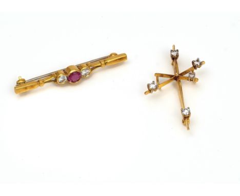A RUBY AND DIAMOND BAR BROOCH AND A DIAMOND SOUTHERN CROSS BROOCH (2)The 18ct gold bar brooch mounted with a circular cut rub
