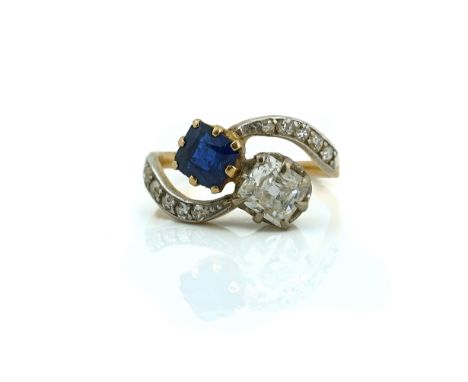 A GOLD, SAPPHIRE AND DIAMOND RINGClaw set with a mixed cut cushion shaped sapphire and with a mixed cut cushion shaped diamon