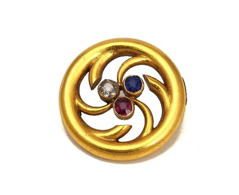 A RUBY, SAPPHIRE AND DIAMOND CIRCULAR BROOCHThe central trefoil shaped motif mounted with cushion shaped gemstones, diameter 