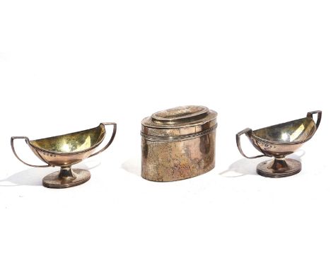 A SILVER TEA CADDY AND TWO SILVER SALTS (3)The tea caddy of oval form, decorated with a reeded band, London 1908, a twin hand