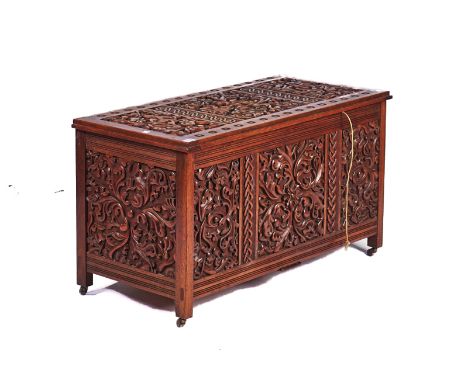 AN EARLY 20TH CENTURY TEAK RECTANGULAR TRUNKWith extensive carved decoration, 88cm wide; 50cm highCondition report:&nbsp;41cm