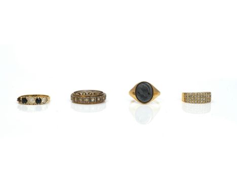 AN 18CT GOLD AND DIAMOND RING AND THREE FURTHER RINGS (4)Comprising; an 18ct gold ring mounted with four rows of circular cut