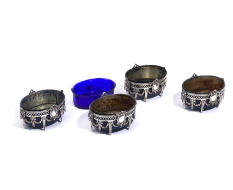 A SET OF FOUR GERMAN OVAL CONDIMENT STANDS (4)Each of oval form, decorated with pendant swags, flowers and bows, raised on si