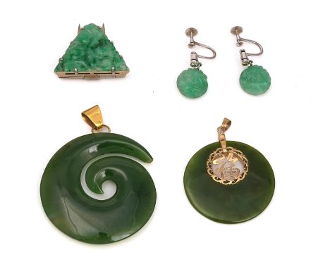 A TRIANGULAR JADE CLIP, A PAIR OF EARRINGS AND TWO NEPHRITE PENDANTS (4)The dress clip carved with fruit, the pair of earring