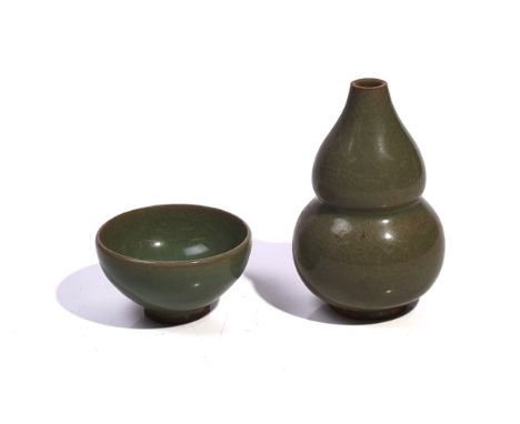 A CHINESE CELADON GLAZED GOURD VASE14cm high; and a Chinese celadon glazed teabowl, 8.5cm diameter (2)Gourd vase- overall cra