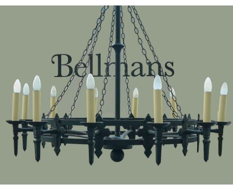 A BLACK PAINTED IRON GOTHIC STYLE TWELVE-LIGHT CHANDELIERModern115cm wide x 112cm highCondition report:&nbsp;Very good condit