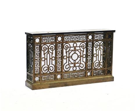 A MARBLE MOUNTED BRASS ALLOY RADIATOR COVERWith open fretwork borders and panels with iron mesh, 116cm wide; 24cm deep; 87cm 