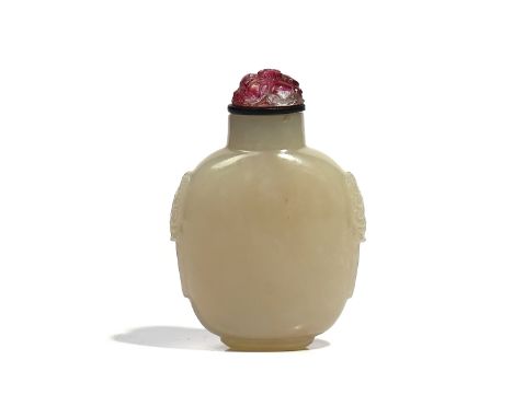 A CHINESE WHITE JADE SNUFF BOTTLEQing dynastyOf oval form with mock lion mask and ring handles, the stone of even milky tone,