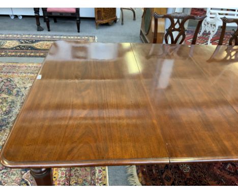 A WILLIAM IV MAHOGANY EXTENDING DINING TABLEOn tapering octagonal supports with three extra leaves, 135cm wide; 145cm long; 3