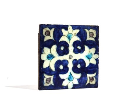 A DAMASCUS POTTERY TILESyria, 18th centuryFoliate design picked out in manganese and turquoise against a blue washed ground, 