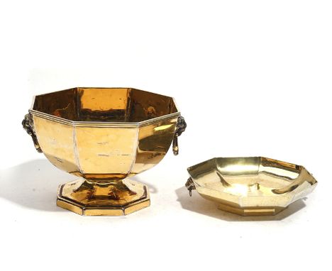A SILVER GILT OCTAGONAL BOWL AND A SILVER GILT OCTAGONAL DISH (2)The bowl with lion mask and ring handles, raised on an octag