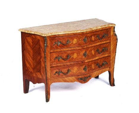 A LOUIS XVI STYLE TULIPWOOD AND MARQUETRY SERPENTINE SHAPED COMMODEWith Brocatello marble top over floral inlaid three drawer