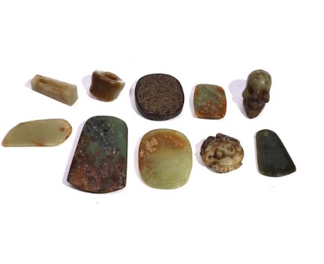 A GROUP OF TEN PIECES OF CHINESE ARCHAISTIC JADEOf various form and colour, comprising; an inkstone, 7.5cm length; a skull, 4