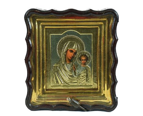 A RUSSIAN ICON OF MADONNA AND CHILD20th CenturyA Russian icon of Madonna and child, painted on gilt metal, with Cyrillic writ