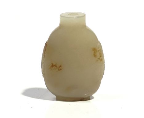 A CHINESE WHITE JADE SNUFF BOTTLEQing dynastyOf pear form with mock elephant mask handles, the stone of even tone with russet